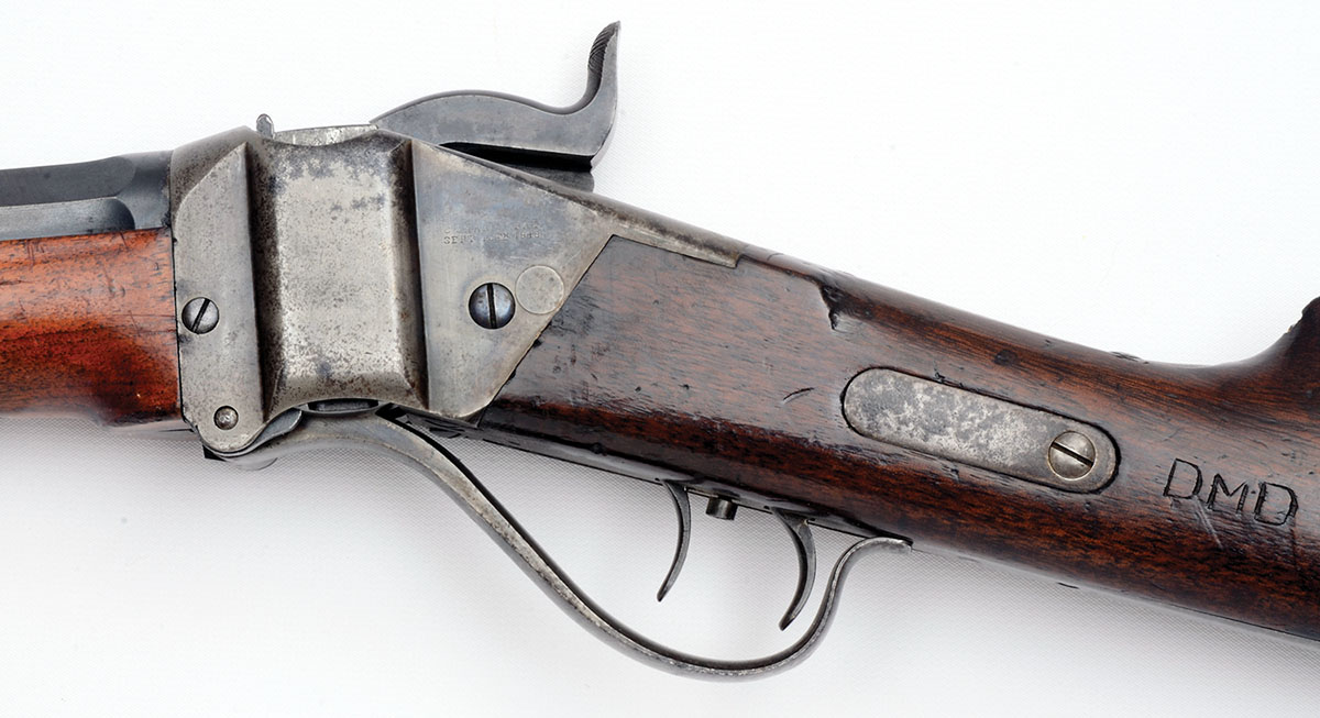 Note the oblong steel inserted into the wrist of the Sharps stock and the barely discernible filled-in round hole at the edge of the receiver. Those were for a sling bar so troopers could carry their carbines on a wide leather sling.
